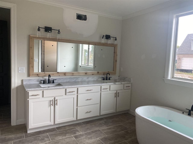 bathroom featuring a bath, dual vanity, tile floors, and crown molding