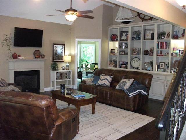 living room featuring ceiling fan and light hardwood / wood-style flooring