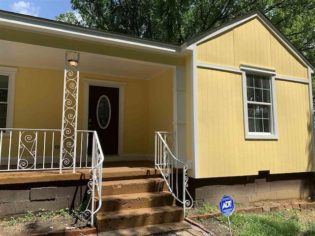 doorway to property with a porch