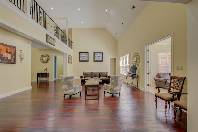 living room featuring high vaulted ceiling and dark hardwood / wood-style floors