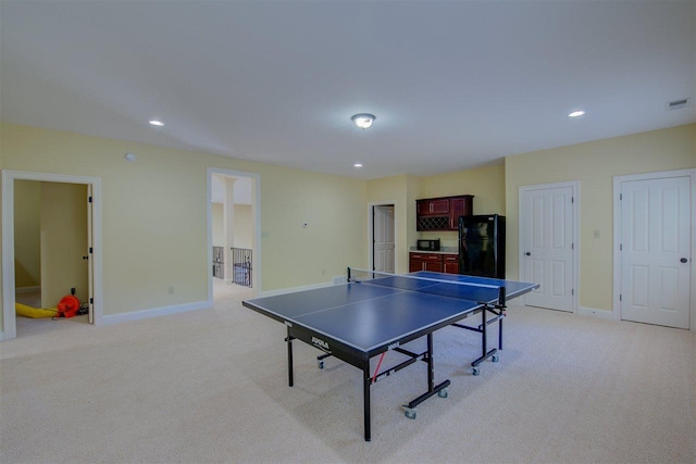 game room with light colored carpet