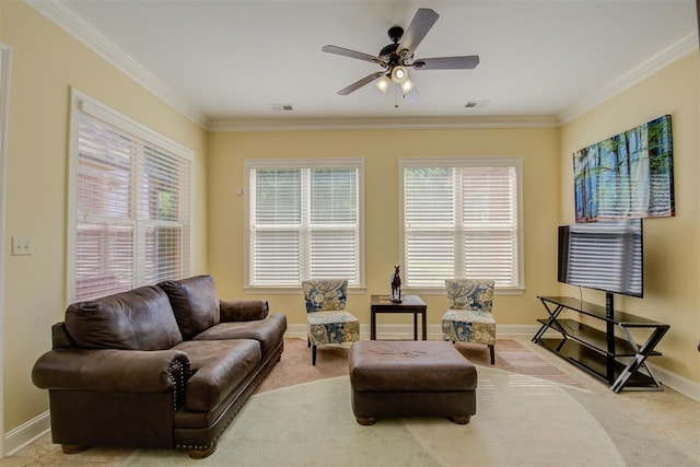 living room with crown molding, ceiling fan, and light colored carpet