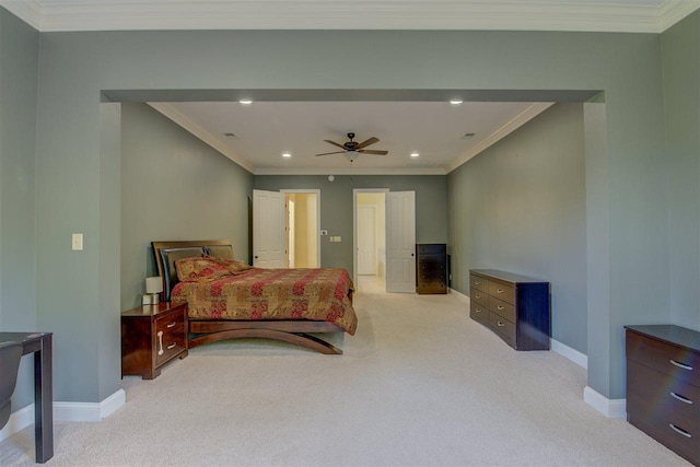 carpeted bedroom with ornamental molding and ceiling fan