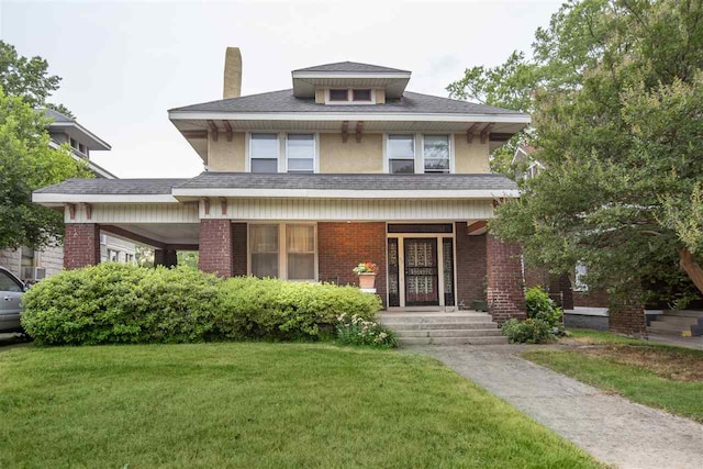 view of front facade with covered porch and a front yard