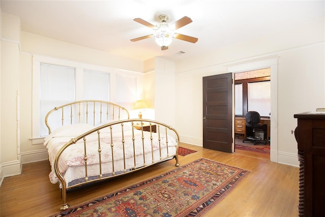 bedroom with ceiling fan and light hardwood / wood-style flooring