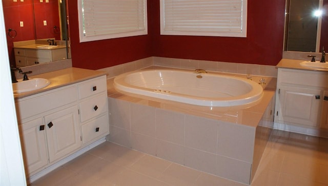 bathroom featuring dual bowl vanity, tile flooring, and a relaxing tiled bath