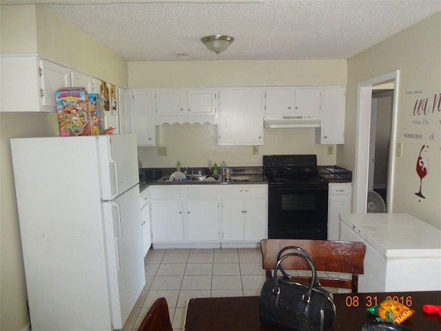 kitchen featuring white cabinets, black electric range oven, and white refrigerator