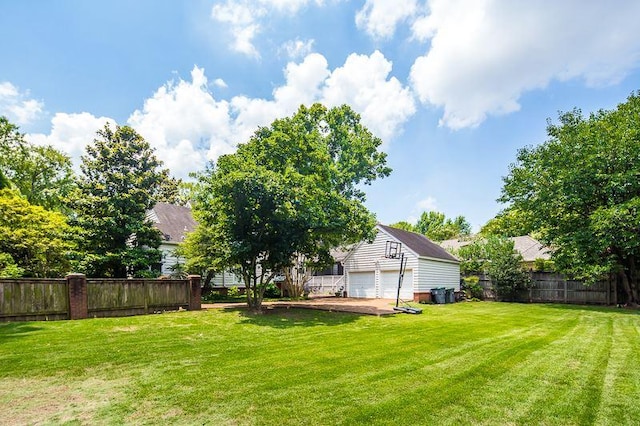 view of yard featuring a garage