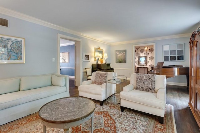 living room featuring ornamental molding and wood-type flooring