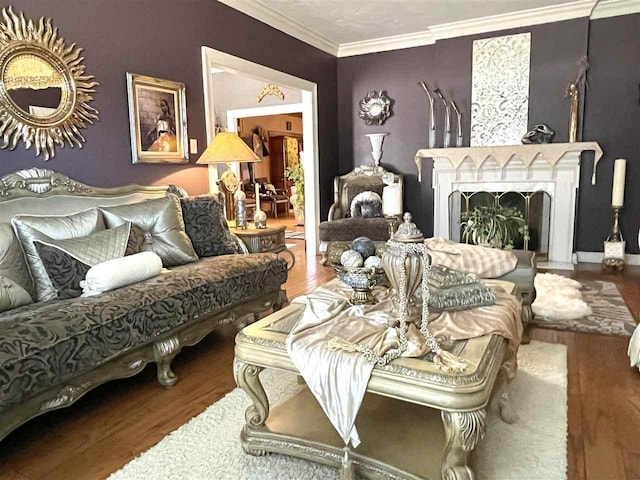 sitting room with crown molding and dark wood-type flooring