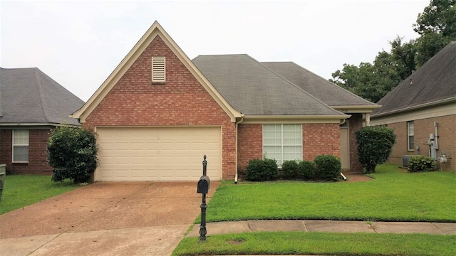 view of front of house featuring a front yard and a garage