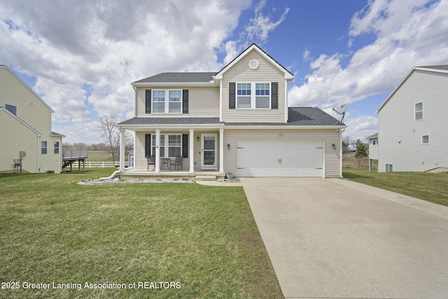 4246 Black Cherry Ln, Mason, MI 48854 - traditional-style house with covered porch, driveway, a front lawn, and an attached garage