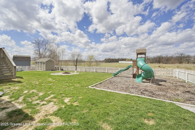 4246 Black Cherry Ln, Mason, MI 48854 - fenced backyard with a shed, an outdoor fire pit, and stairway