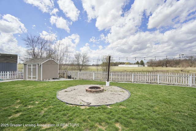4246 Black Cherry Ln, Mason, MI 48854 - fenced backyard with an outdoor fire pit and a shed