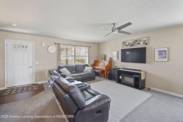 4246 Black Cherry Ln, Mason, MI 48854 - living room featuring a ceiling fan and carpet flooring