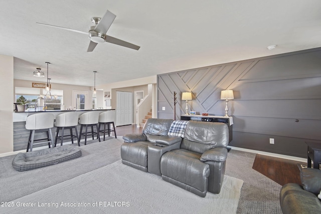 4246 Black Cherry Ln, Mason, MI 48854 - carpeted living room with stairs and ceiling fan