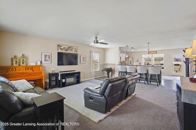 4246 Black Cherry Ln, Mason, MI 48854 - living room featuring healthy amount of natural light, carpet floors, and ceiling fan