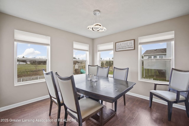 4246 Black Cherry Ln, Mason, MI 48854 - dining room with dark wood-style floors and a chandelier
