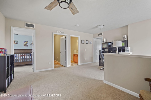 4246 Black Cherry Ln, Mason, MI 48854 - living area with light carpet, a desk, and ceiling fan