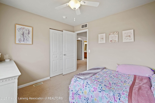 4246 Black Cherry Ln, Mason, MI 48854 - bedroom featuring light carpet, a closet, and ceiling fan