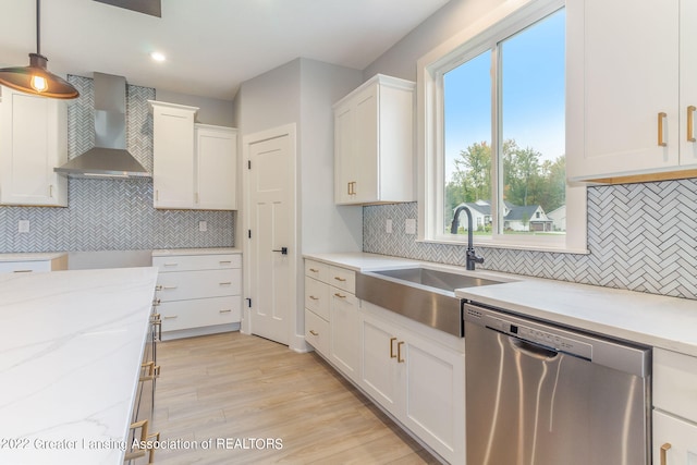 kitchen with stainless steel dishwasher, wall chimney range hood, tasteful backsplash, and pendant lighting