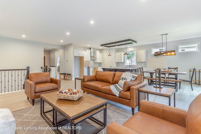 living room featuring light hardwood / wood-style floors and sink