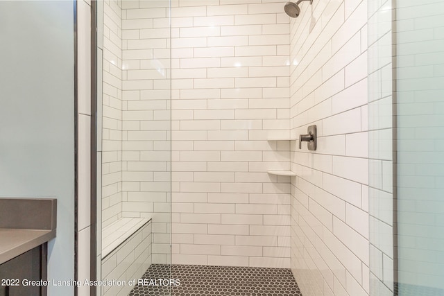 bathroom with a tile shower