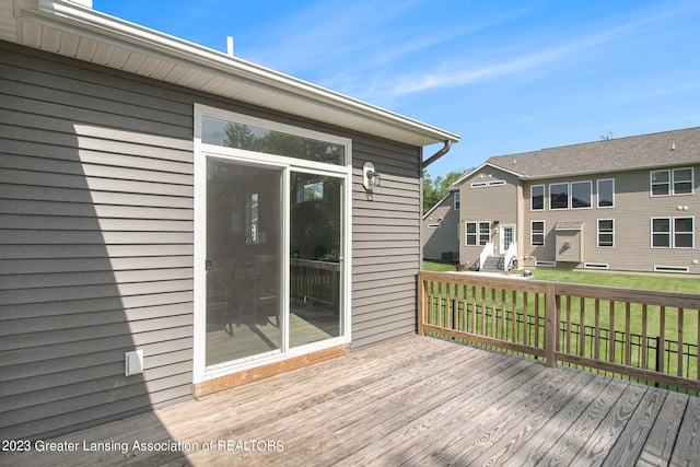 deck featuring a yard