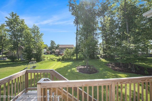 deck featuring a lawn