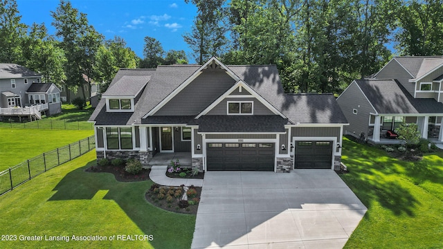 view of front of house with a front lawn and a garage