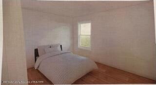 bedroom featuring hardwood / wood-style floors