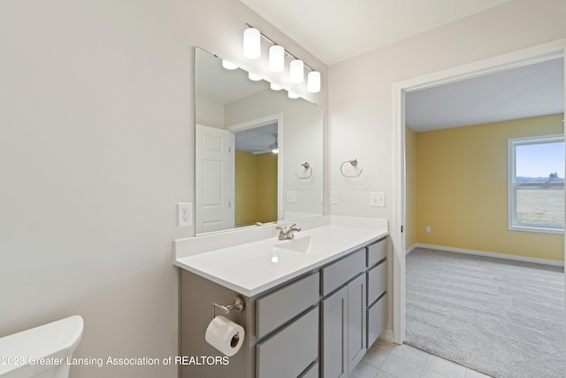 bathroom with ceiling fan, tile flooring, toilet, and vanity