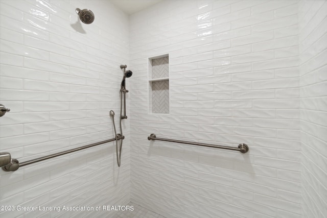 bathroom with a tile shower