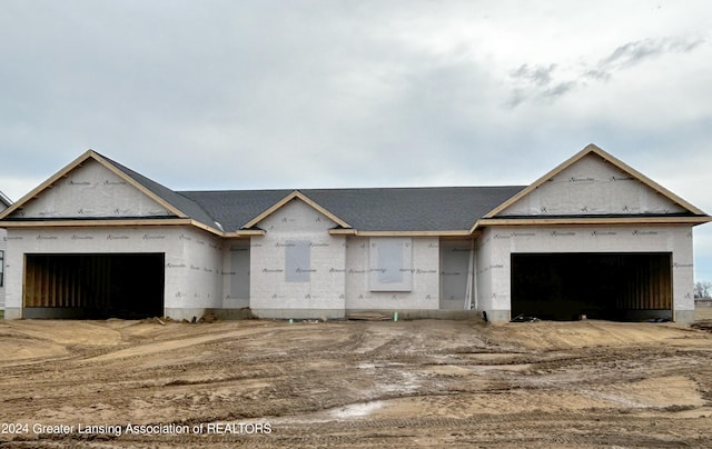 unfinished property with a garage