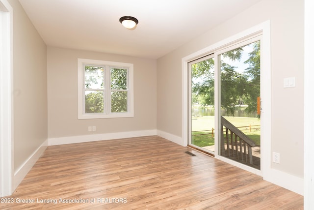 empty room with light wood-type flooring