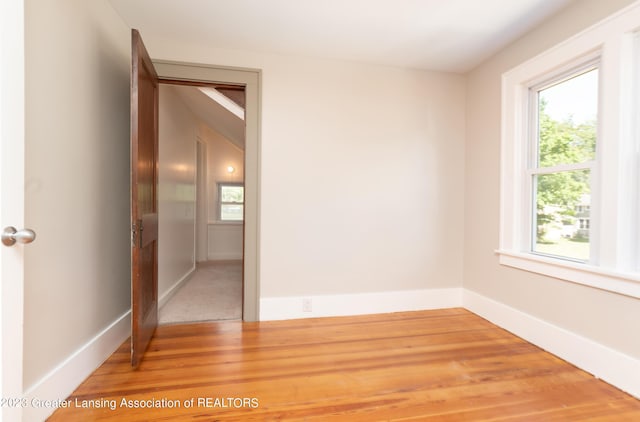 unfurnished room featuring hardwood / wood-style floors