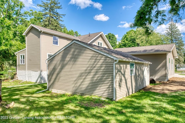 view of property exterior featuring a yard