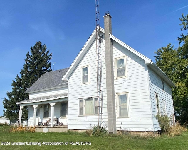 exterior space featuring a front yard and a porch