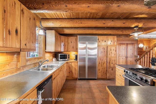 kitchen featuring beam ceiling, tile flooring, high end appliances, and sink