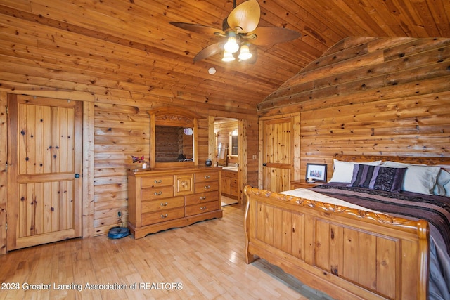 bedroom featuring ceiling fan, light wood-type flooring, wooden ceiling, ensuite bath, and lofted ceiling