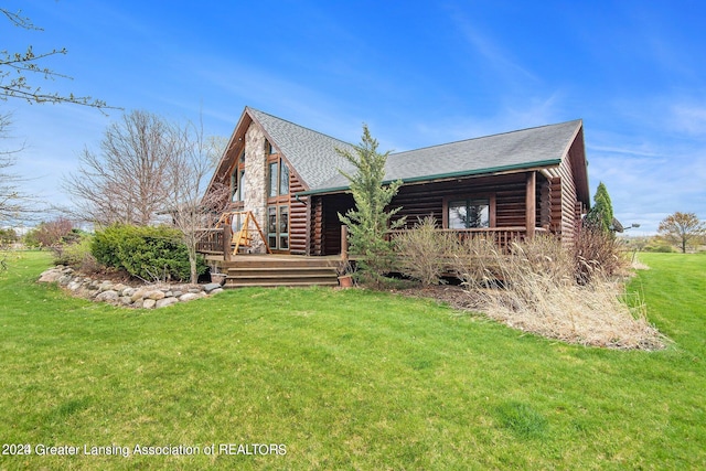 log home with a deck and a front lawn