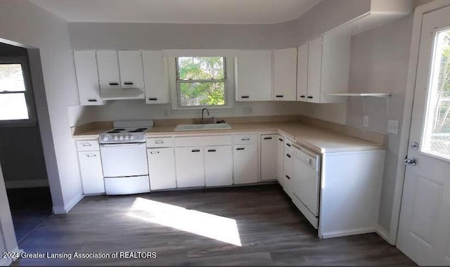 kitchen with a healthy amount of sunlight, sink, white cabinets, and white appliances