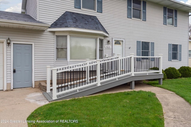 exterior space with a deck and a yard