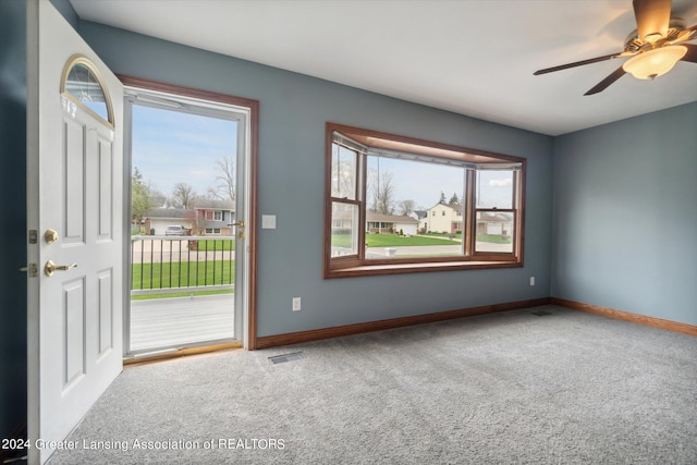 carpeted empty room with ceiling fan