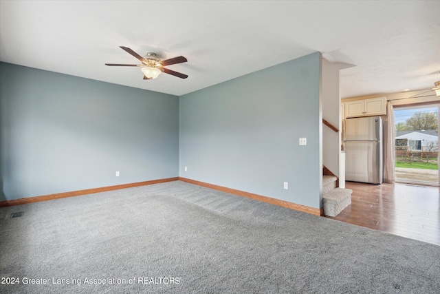 spare room with ceiling fan and hardwood / wood-style flooring