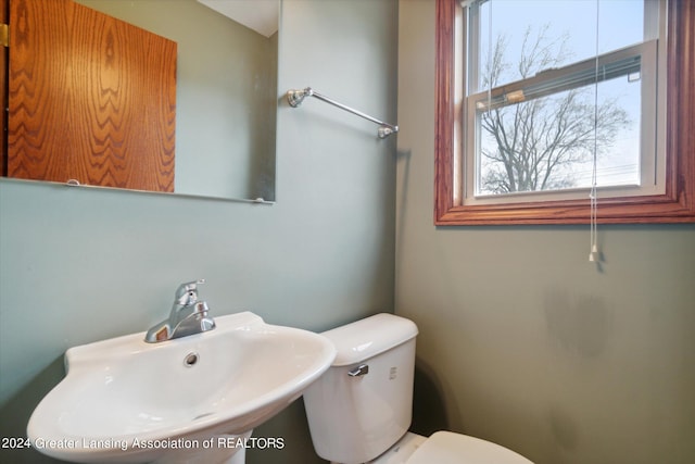 bathroom with sink and toilet