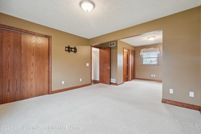 unfurnished bedroom with carpet flooring