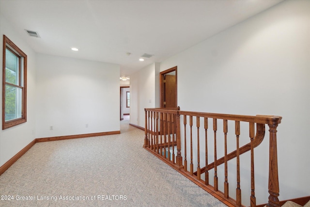 hall featuring carpet floors