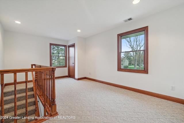 empty room featuring light colored carpet