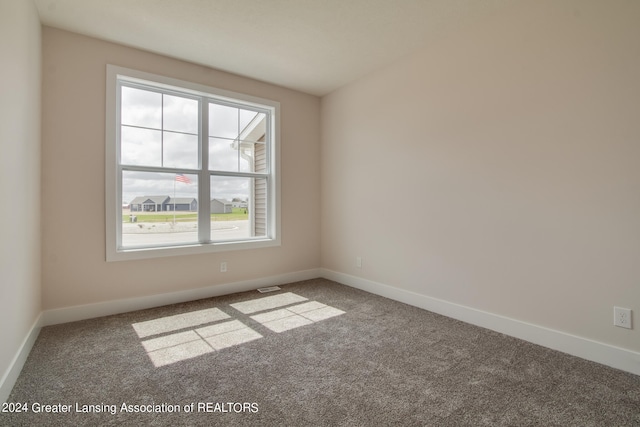 empty room with carpet flooring